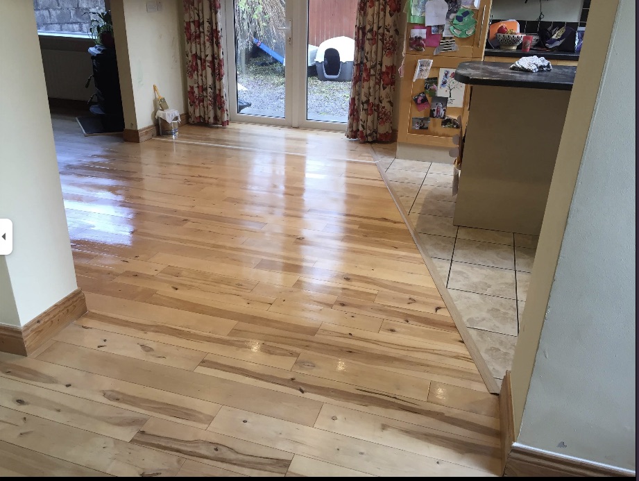 Finished solid timber floor running from hall through to kitchen