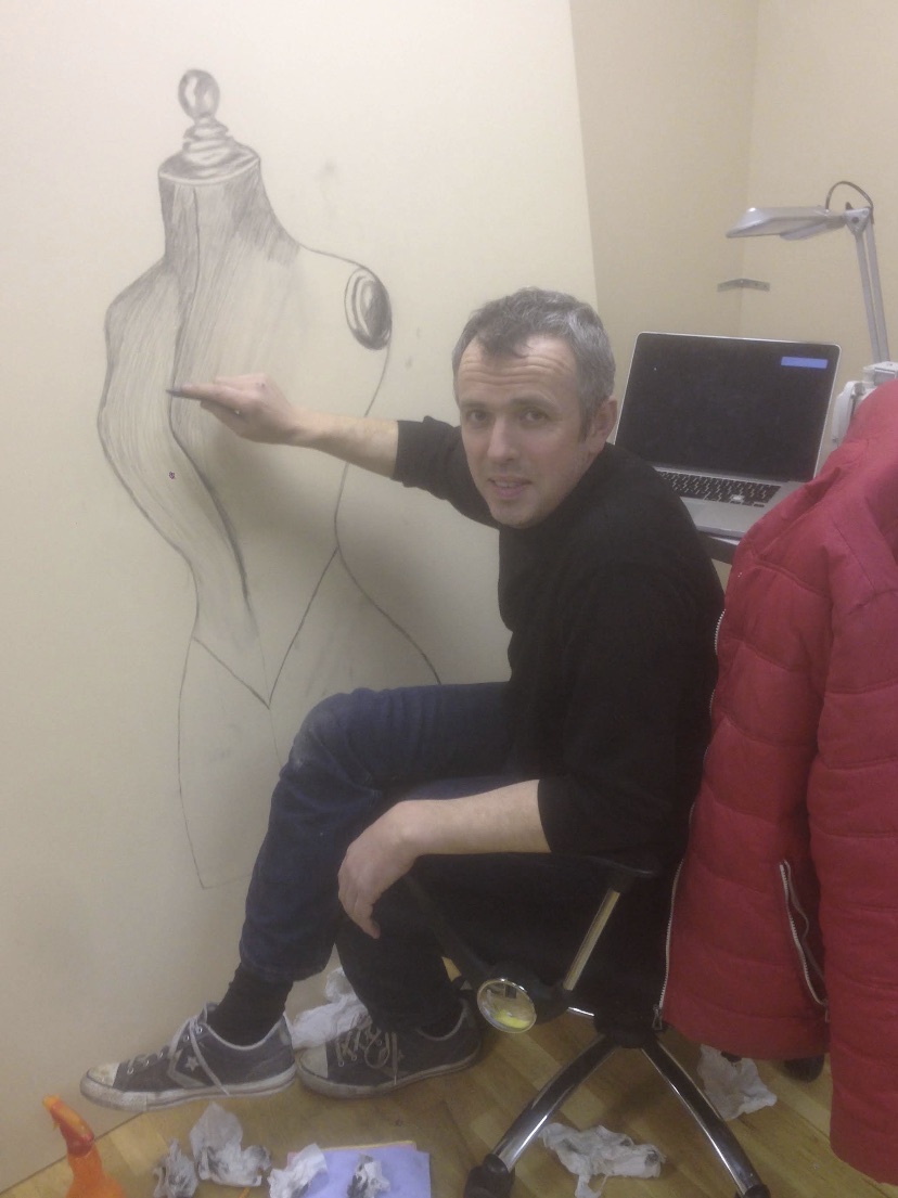 Setting out a full-size design drawing on the workshop wall